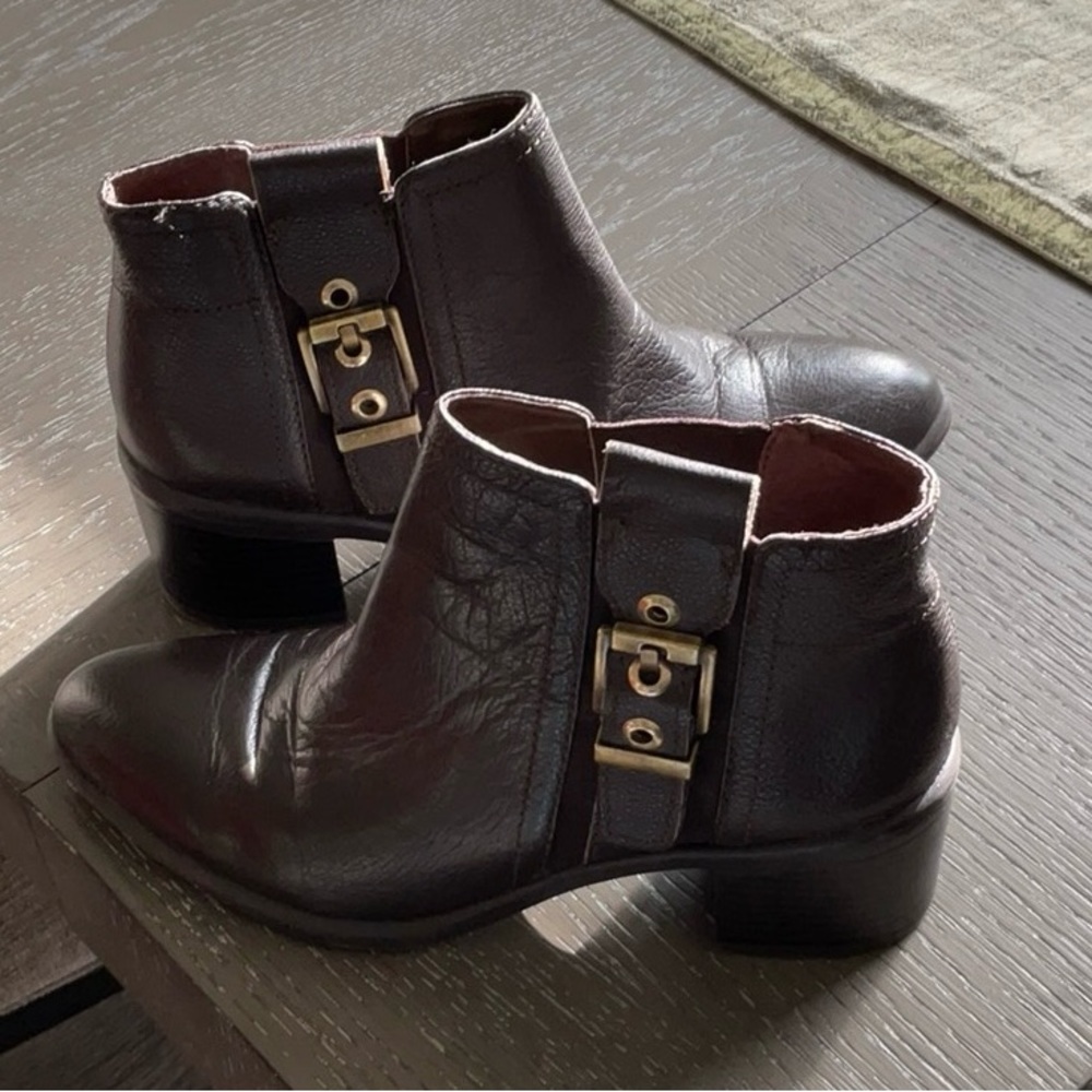 Franco Sarto Black/ Brown Bootie with gold buckle and side goring stretch.